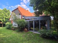 Hausansicht und Wintergarten
