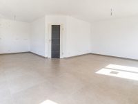 Wohnzimmer mit offener Küche / Musterbild